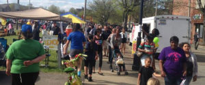 People enjoying a neighborhood street fair